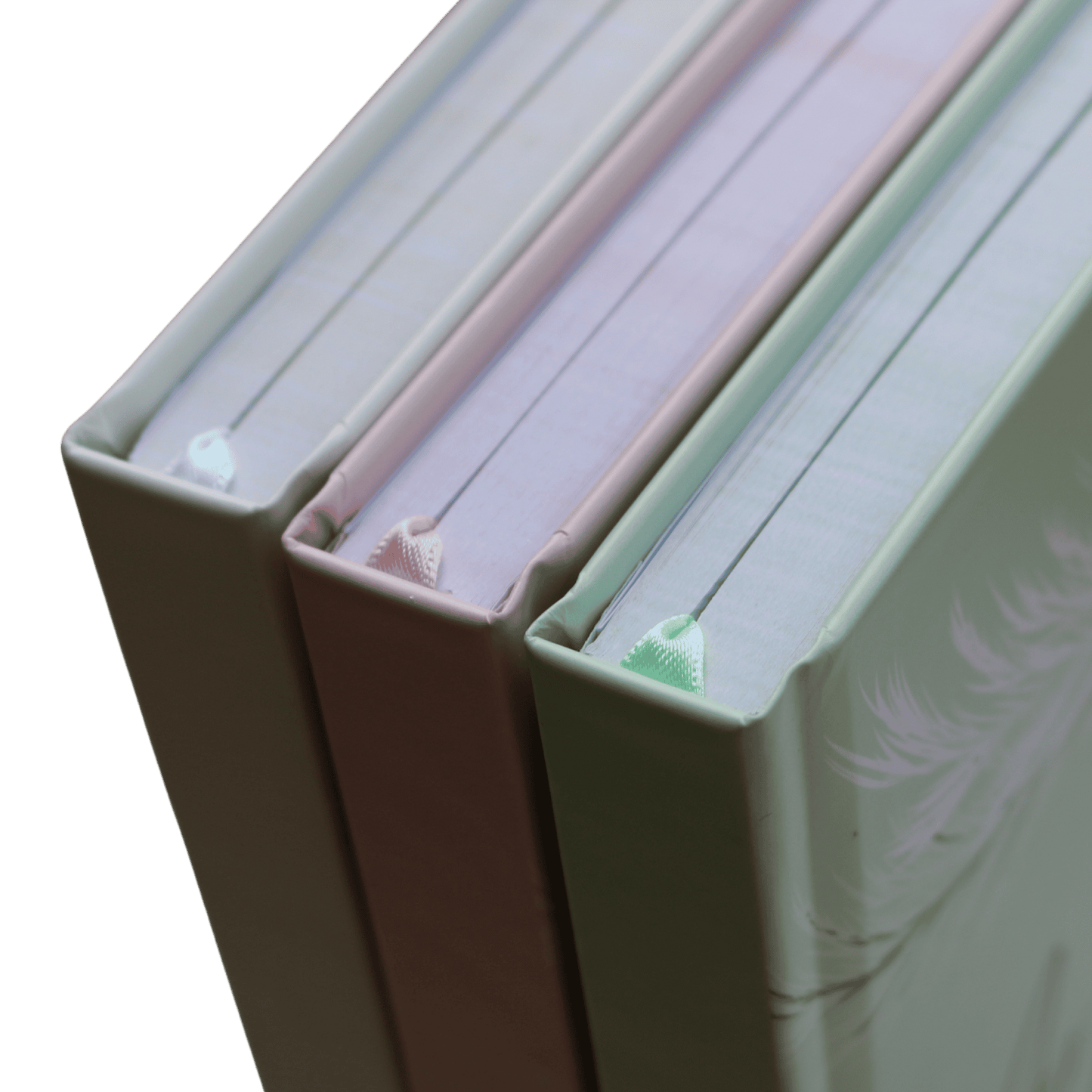 Three books with pastel covers