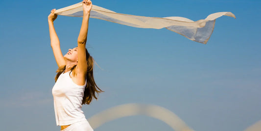 Woman waving cloth above head