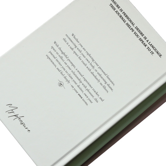 Book wtih black text and stacked on top of other books